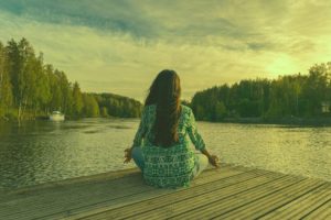 Woman meditating and finding purpose in life